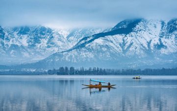 A view of Dal Lake in winter, and the beautiful mountain range in the background in the city of Srinagar, Kashmir, India.